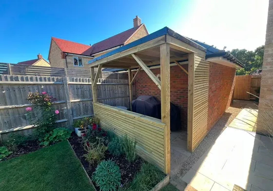 A timber framed enclosure built in a new-build garden.