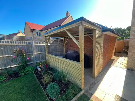 A timber framed enclosure built in a new-build garden.